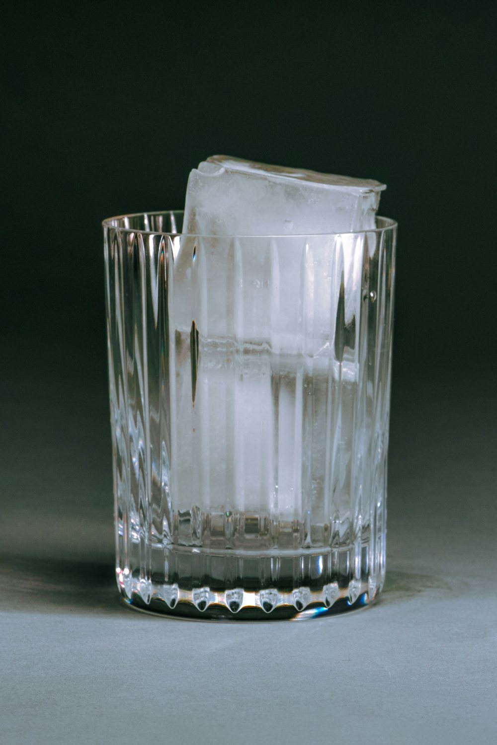 Ice suspended in golden-orange liquid
